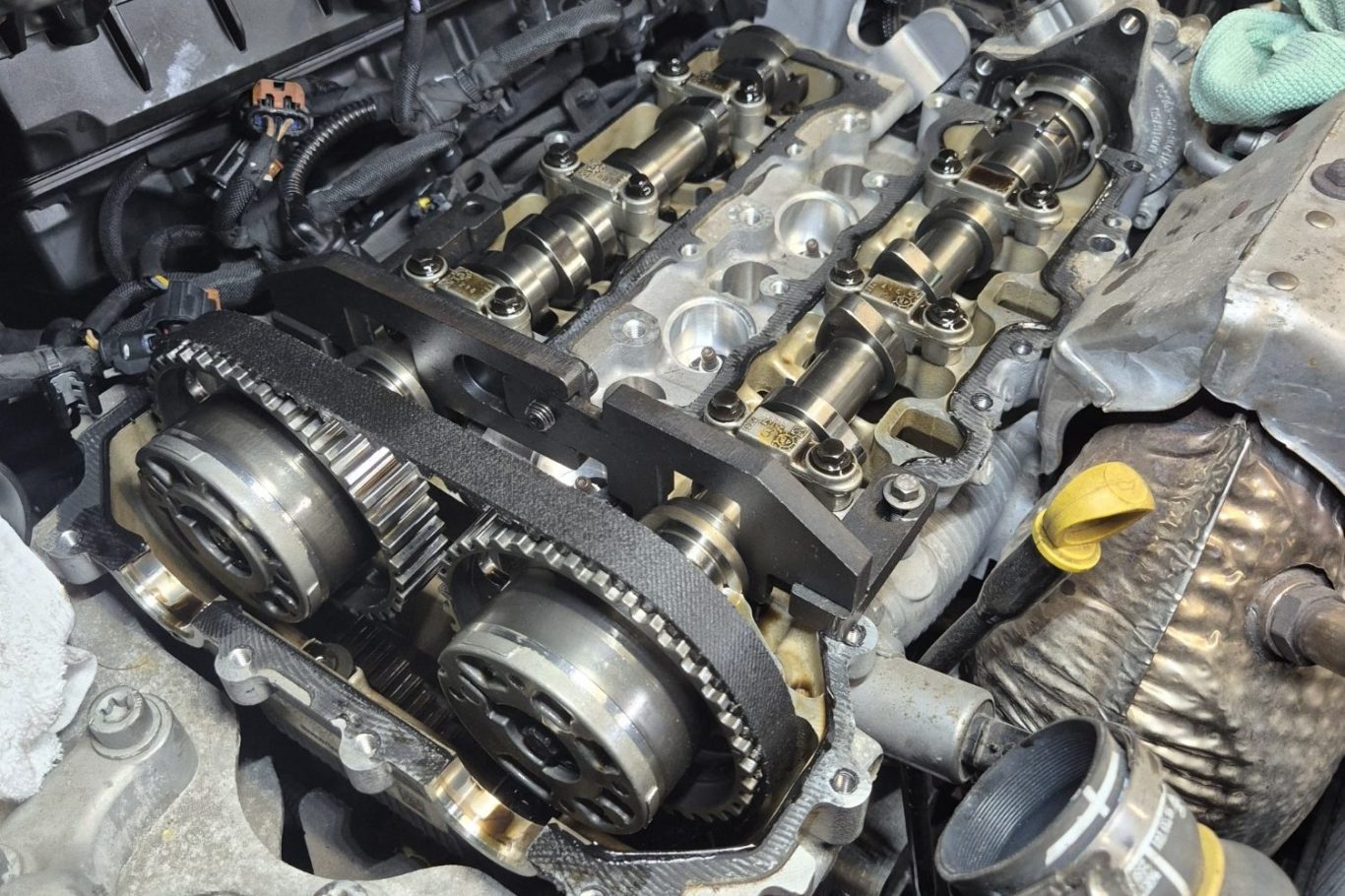 Vehicle Repairs Close-up of an engine's camshaft and valve assembly.